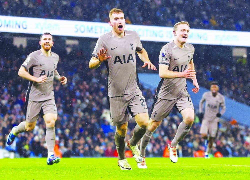 
Tottenham Hotspur’s Dejan Kulusevski celebrates with teammates Pierre-Emile Hojbjerg and Oliver Skipp after scoring their third goal against Manchester City yesterday. (Reuters) 