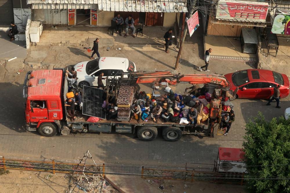 Palestinians fleeing Khan Yunis arrive in Rafah further south near the Gaza Strip's border with Egypt on Tuesday, after Israeli forces were seen the previous day on the outskirts of Khan Yunis, which is packed with displaced civilians. AFP