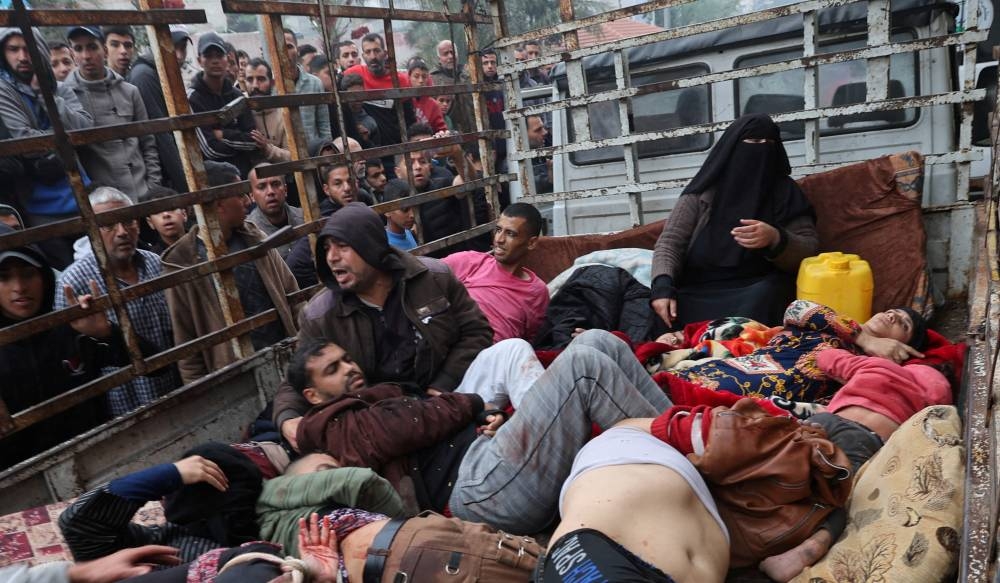 Wounded Palestinians are transported to Nasser hospital, following Israeli strikes, in Khan Younis in the southern Gaza Strip, on Tuesday. REUTERS