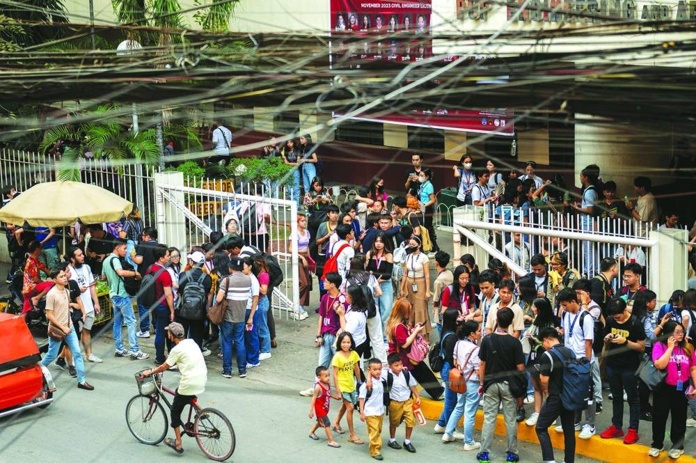 
Students evacuate following an earthquake, in Manila, Philippines, yesterday. 