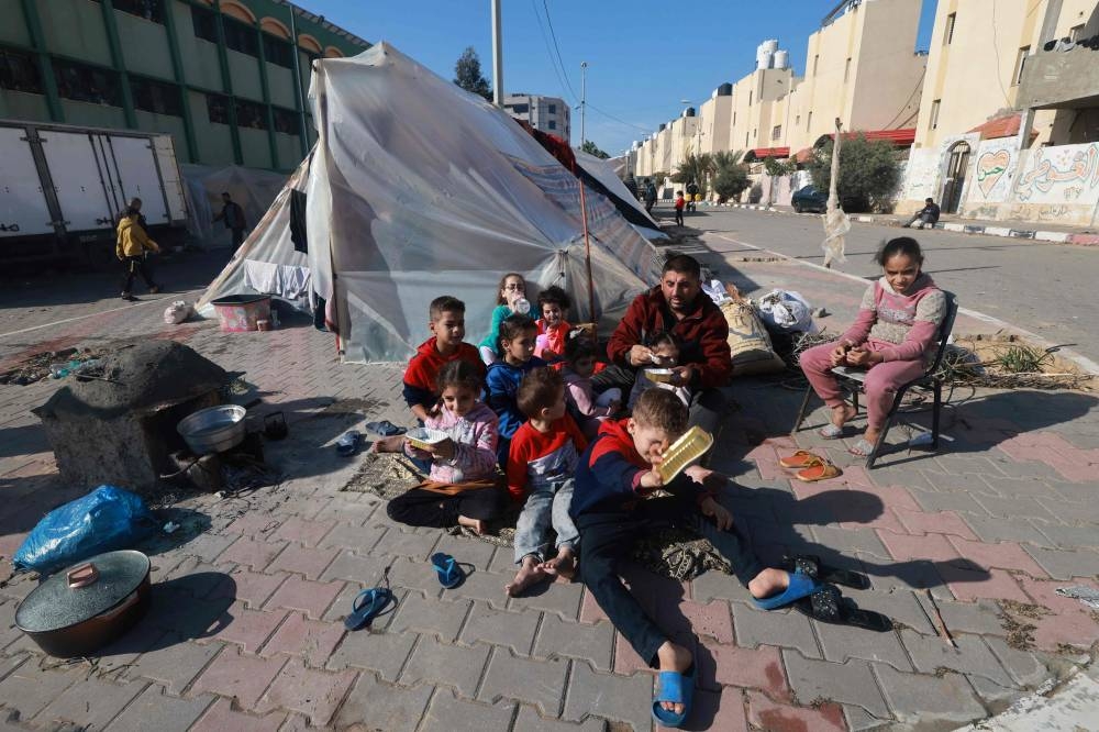 A displaced Palestinian family who fled Khan Yunis sets up camp in Rafah further south near the Gaza Strip's border with Egypt, , on Wednesday. AFP