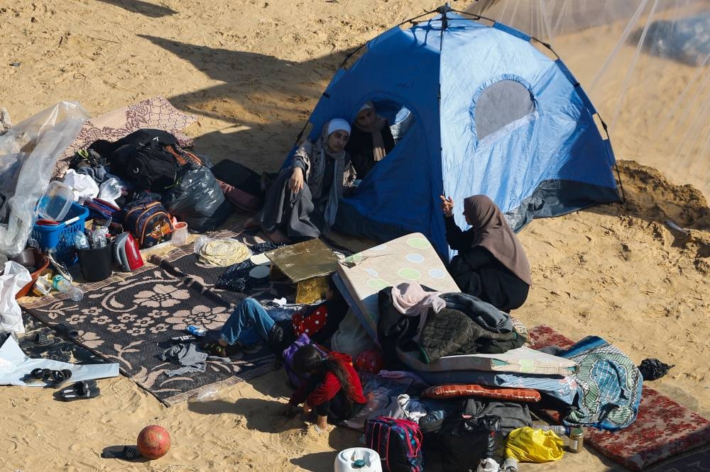 Displaced Palestinians, who fled their houses due to Israeli strike, shelter in a camp in Rafah in the southern Gaza Strip, on Wednesday. REUTERS