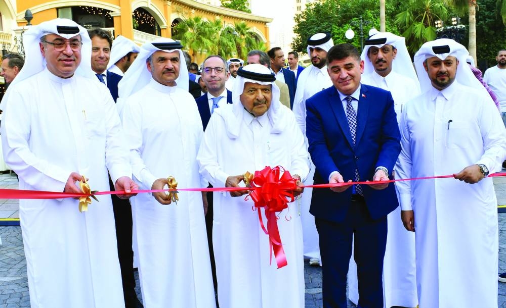 HE Sheikh Faisal bin Qassim al-Thani led the ribbon-cutting ceremony of the Qatar Classic Cars contest and exhibition 2023 Wednesday at The Pearl Island's Medina Centrale as Omar Alfardan and other dignitaries looked on. PICTURE: Thajudheen