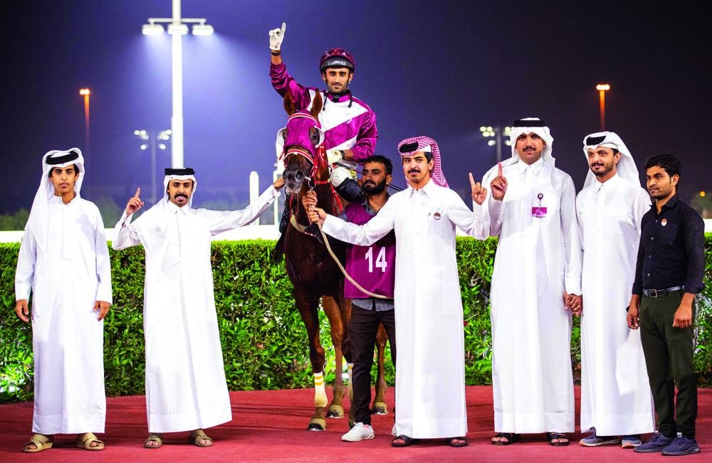 
The connections of Suheal Qatar celebrate after the Bu Samrah Cup win. 