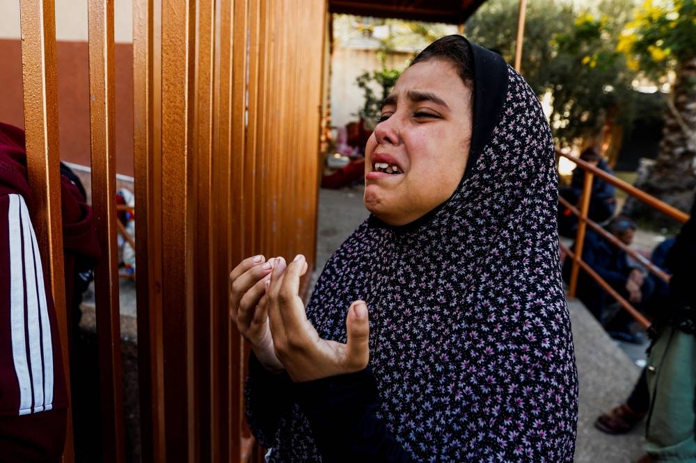 A girl mourns during a funeral for Palestinians killed in Israeli strikes, at Nasser hospital in Khan Younis in the southern Gaza Strip, on Saturday. REUTERS