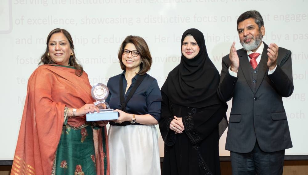 TNG director Riyaz Ahmed Bakali cheers as an award is presented.