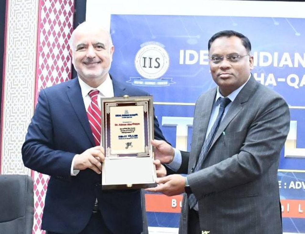 Principal Shaik Shamim Saheb presents a memento to Dr Adnan Abu-Dayya.