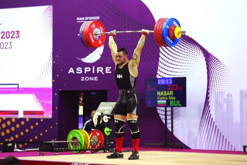 Bulgaria's Karlos May Nasar on way to victory in the men's 89kg competition on seven of the Qatar Cup IWF Grand Prix II. Nasar managed an overall lift of 
393kg.