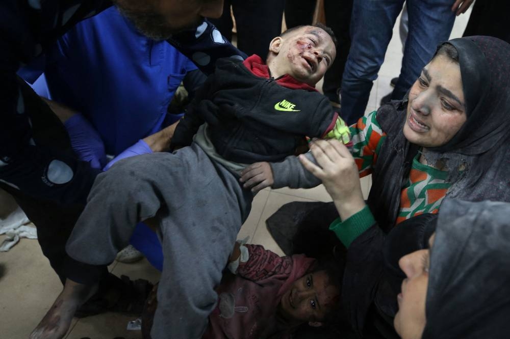 Palestinians injured following Israeli strikes on al-Maghazi refugee camp receive care at Al-Aqsa hospital in Deir Balah in the central Gaza Strip, on Monday. AFP