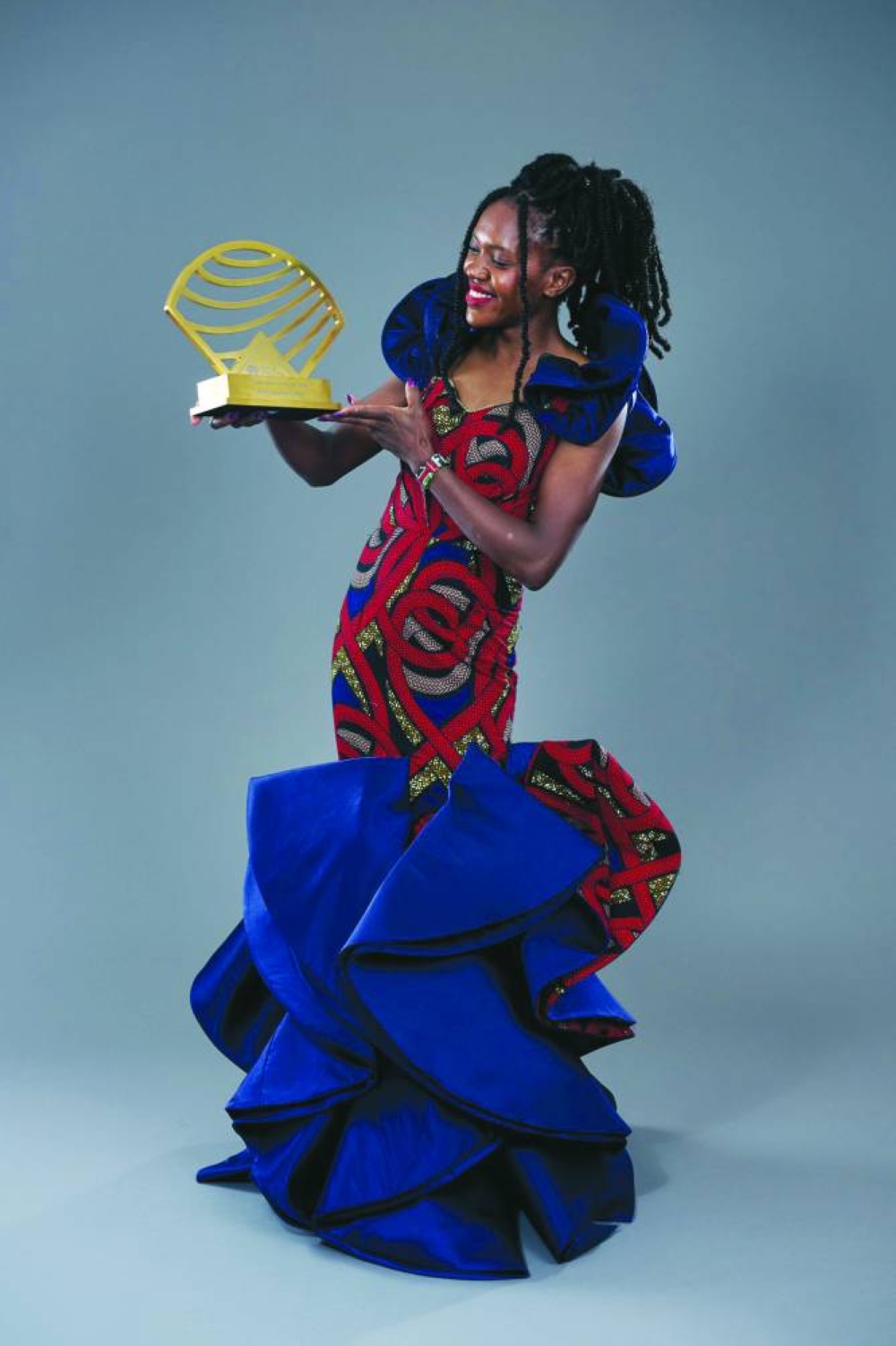 
Kenya’s Faith Kipyegon celebrates with her award.
 