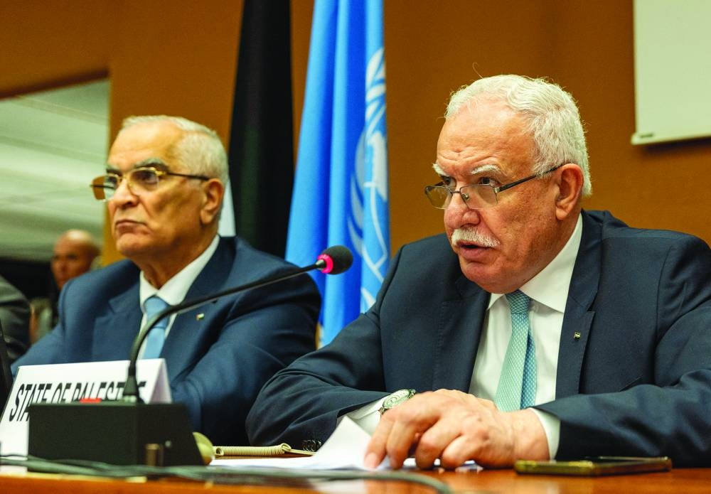 
Foreign Minister of the Palestinian National Authority Riyad al-Maliki (right) attends a side event during an event commemorating the 75th Anniversary of the Universal Declaration of Human Rights, amid the ongoing Israel-Hamas conflict, at the UN in Geneva, yesterday. 