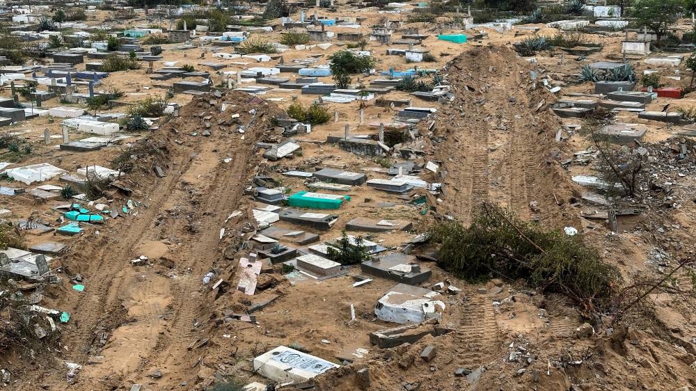 Graves damaged during the Israeli ground offensive are seen in the Fallujah neighborhood, in Jabalia in the northern Gaza Strip,, on Wednesday. REUTERS