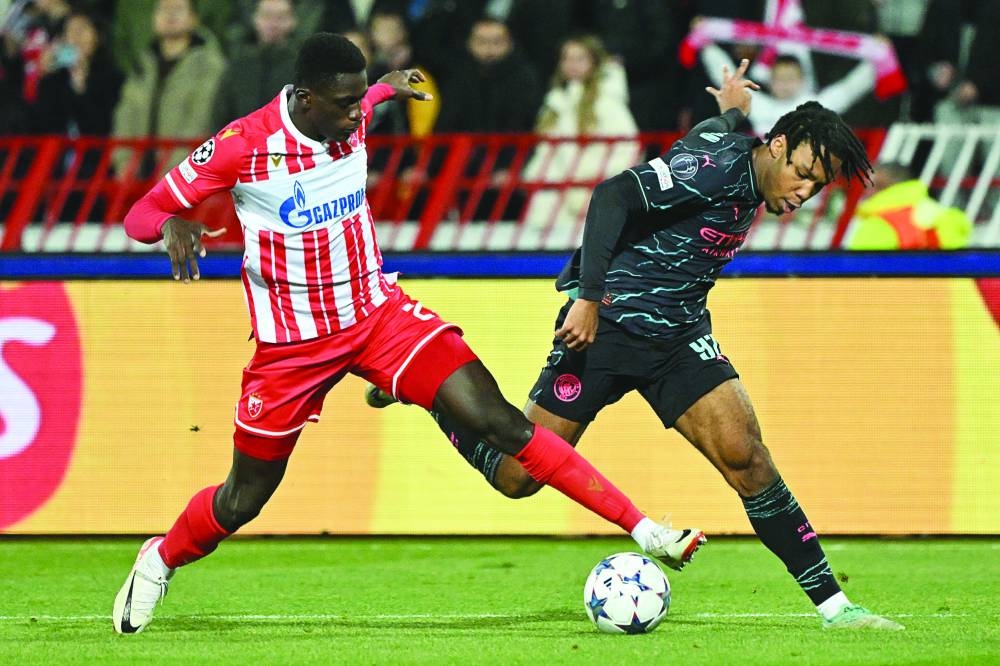 
Red Star’s Nasser Djiga (left) vies for the ball with Manchester City’s Micah Hamilton during the Champions League group stage match. (AFP) 