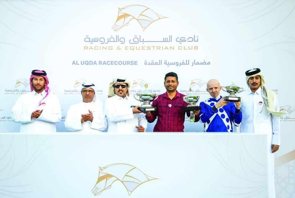 Connections of Never Simple celebrate after Al Uqda Cup victory at the Al Uqda Racecourse yesterday. PICTURES: Juhaim