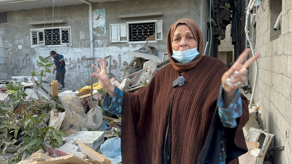 A Palestinian woman gestures at the site of an Israeli strike on a house in Khan Youni, in the southern Gaza Strip, on Saturday. REUTERS