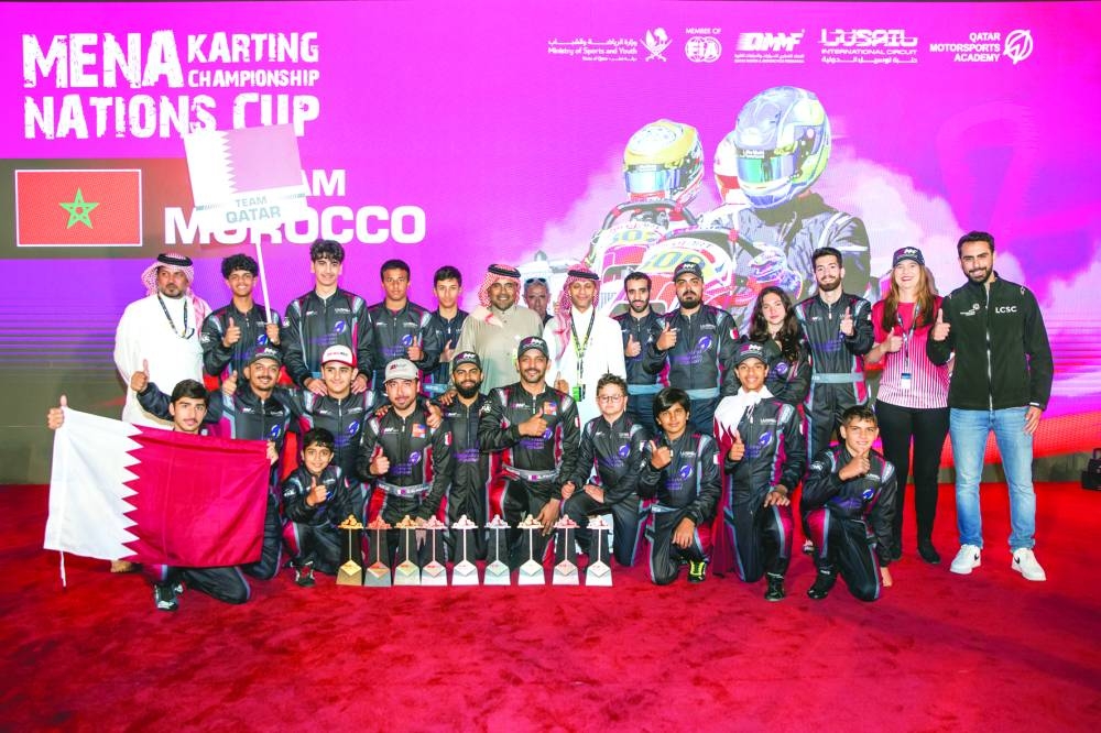 QMMF and LIC President Abdul Rahman bin Abdul Latif al-Mannai and Executive Director of QMMF and CEO of LIC Amro al-Hamad pose with the Qatar team, which finished overall third at the Mena Karting Championship Nations Cup on Saturday.
