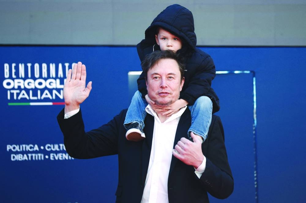Tesla and SpaceX’s CEO Elon Musk accompanied by his son attends political festival Atreju organised by Italian Prime Minister Giorgia Meloni’s Brothers of Italy (Fratelli d’Italia) right-wing party in Rome on Saturday. (Reuters)