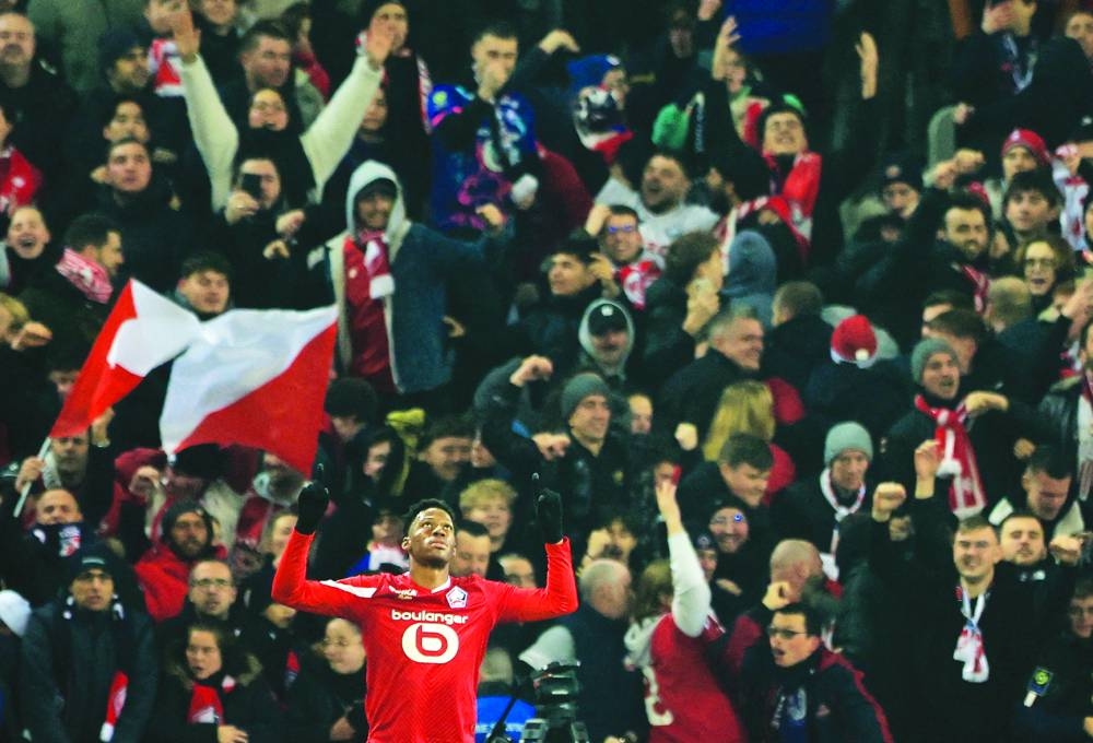Lille’s Jonathan David celebrates after scoring against Paris St Germain during the Ligue 1 match on Sunday. (Reuetrs)