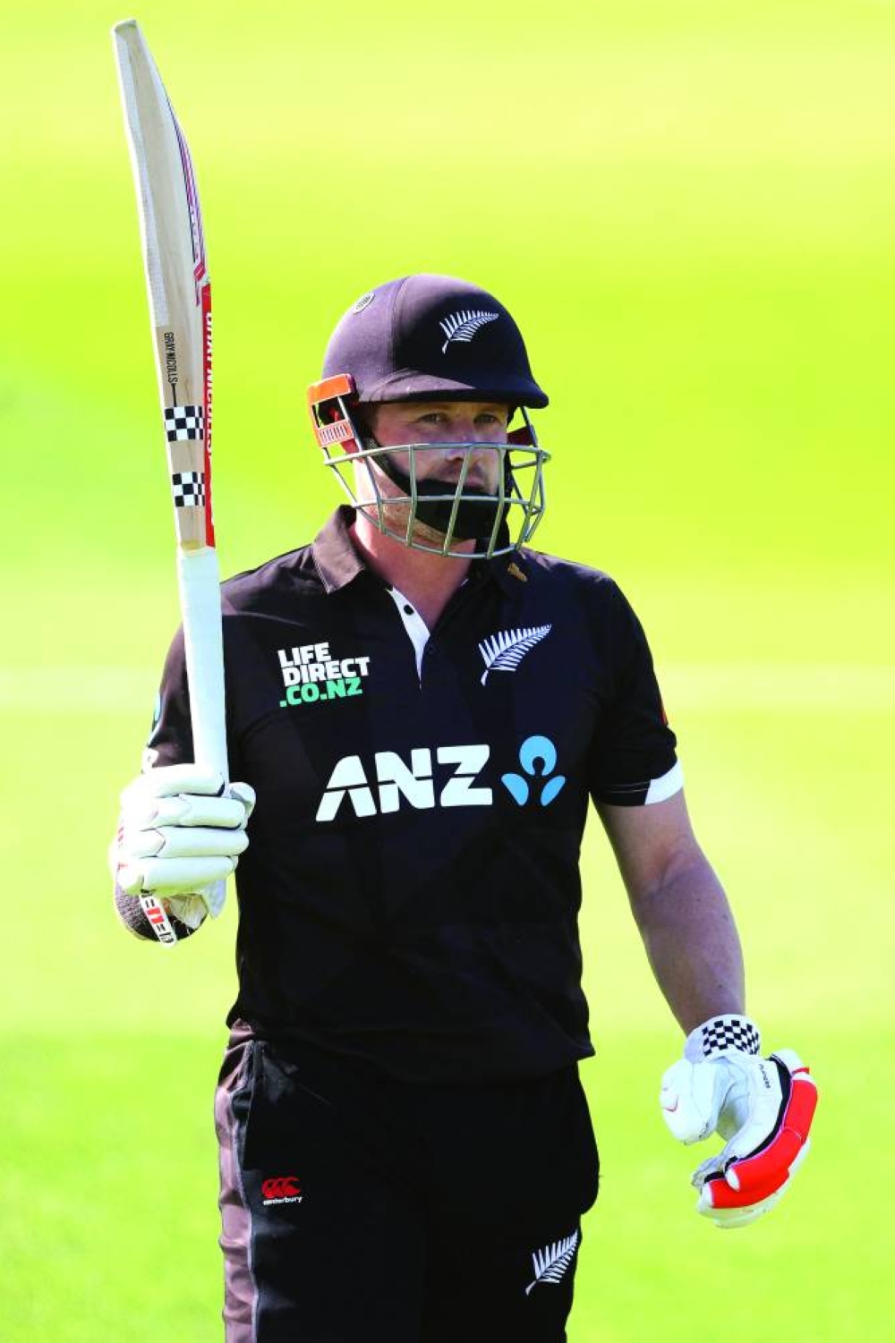 New Zealand’s Henry Nicholls lifts his bat as he walks from the field after being caught during the second ODI against Bangladesh at Saxton Oval in Nelson on Wednesday. (AFP)