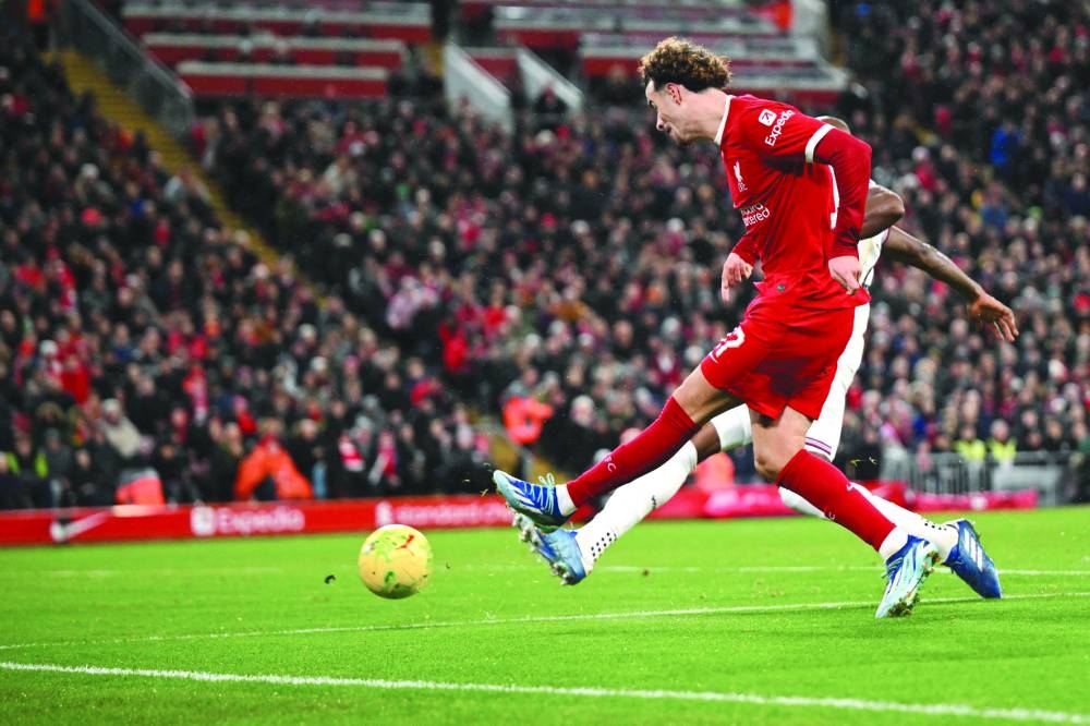 
Liverpool’s Curtis Jones shoots to score his team’s second goal during the English League Cup quarter-final against West Ham United at Anfield in Liverpool. (AFP) 