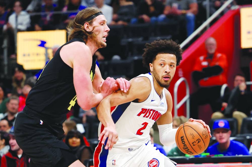 
Detroit Pistons guard Cade Cunningham dribbles defended by Utah Jazz forward Kelly Olynyk in the first-half of their NBA game at Little Caesars Arena in Detroit. (USA TODAY Sports) 