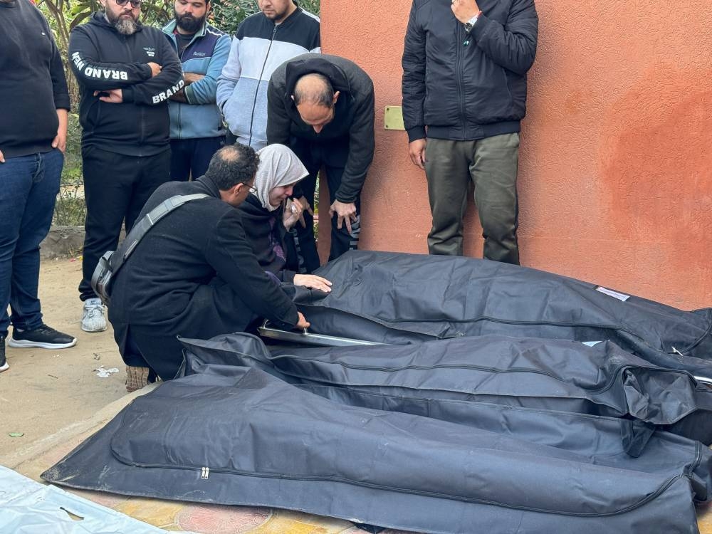 Mourners react next to the bodies of Palestinians killed in Israeli strikes at Nasser hospital in Khan Younis, in the southern Gaza Strip, on Saturday. REUTERS