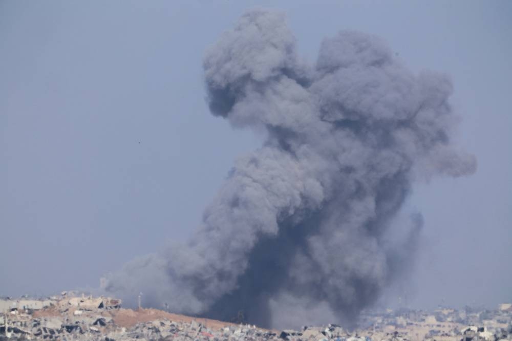 Smoke rises over Gaza as seen from southern Israel, on Sunday. REUTERS