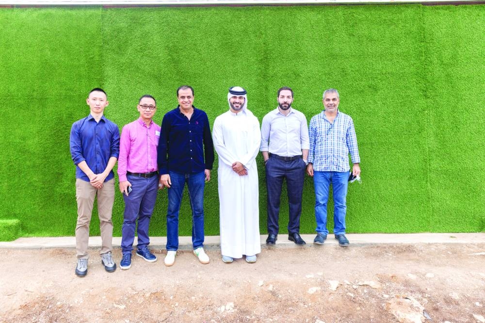 Fardan Fahad Alfardan with journalists at the Wahat Al-Shafalahia farm.