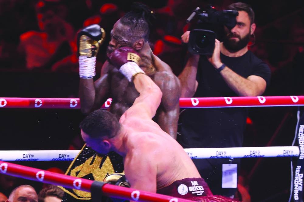 US’ Deontay Wilder and New Zealand’s Joseph Parker in action during their boxing match on Sunday. (AFP)