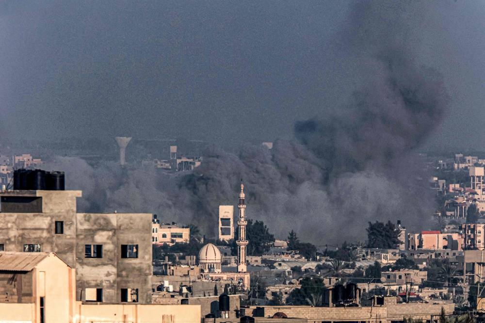 Smoke billows over Khan Yunis during Israeli bombardment from Rafah in the southern Gaza Strip, on Monday. AFP