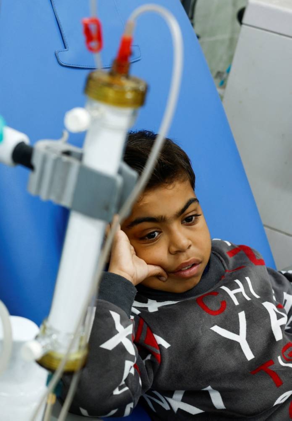 Palestinian boy Naseem Mohra, a 10-year-old kidney patient from northern Gaza who fled south with his family when Israel began the ground assault against Hamas and was separated from his mother, undergoes kidney dialysis at a hospital in Rafah in the southern Gaza Strip, on Monday. REUTERS