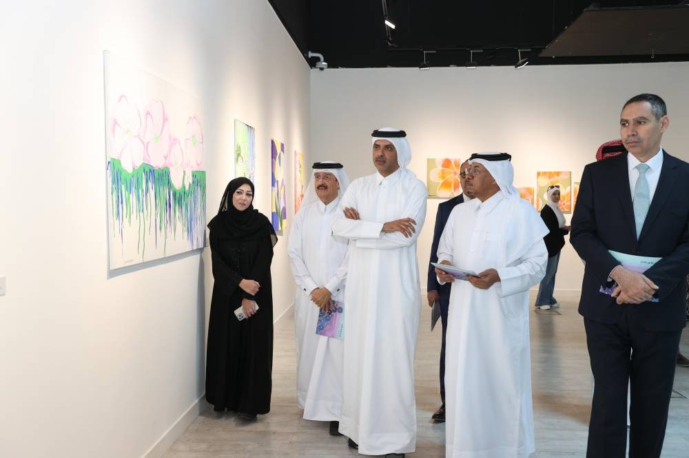 Officials and guests viewing some of the pictures on display
