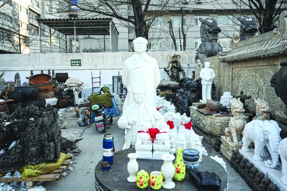 
Statues of the late Chinese Communist leader Mao Zedong are seen in an antique market in Beijing. 