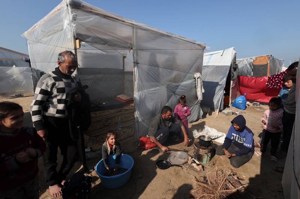 Displaced Palestinians, who fled their homes due to Israeli strikes, shelter in a tent camp, in Rafah, southern Gaza Strip, on Friday. REUTERS