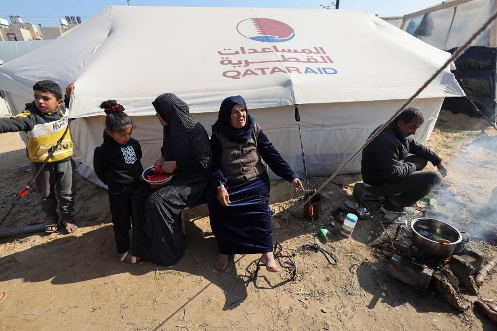 Displaced Palestinians, who fled their homes due to Israeli strikes, shelter in a tent camp in Rafah, southern Gaza Strip, on Friday. REUTERS