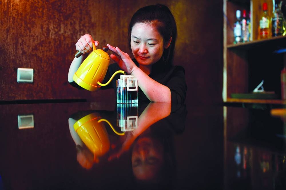 
FILE PHOTO: A barista makes drip coffee at the La Tercera cafe in Beijing. (Reuters) 