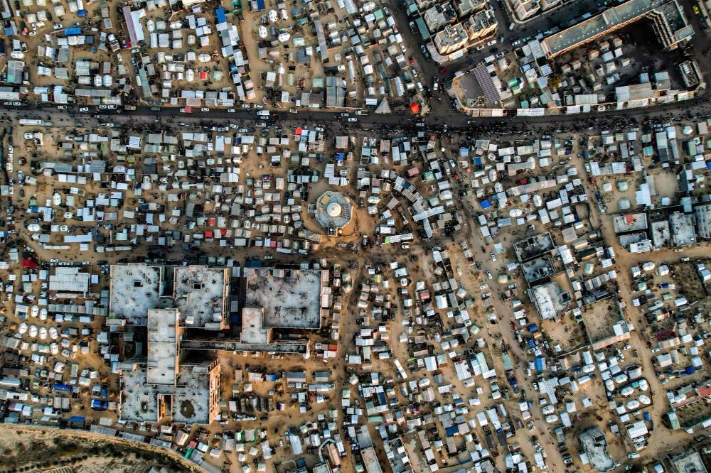 This aerial view shows the tent camps of displaced Palestinians in Rafah in the southern Gaza Strip close to the border with Egypt on Sunday. AFP