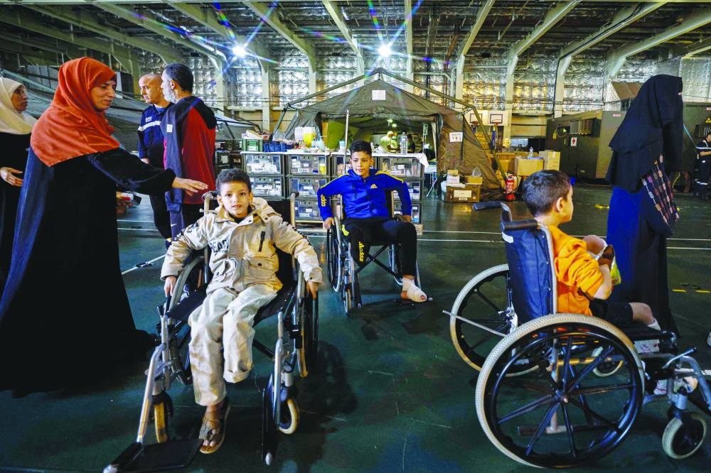 Wounded Palestinians are pictured onboard the French ship Dixmude, which will serve as a hospital, as it docks at the Egyptian port of Al Arish yesterday.