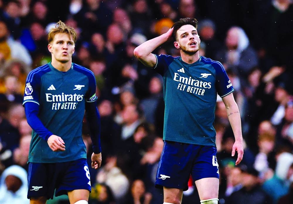 
Arsenal’s Martin Odegaard and Declan Rice react after their team’s loss to Fulham in Premier League on Sunday. (Reuters) 