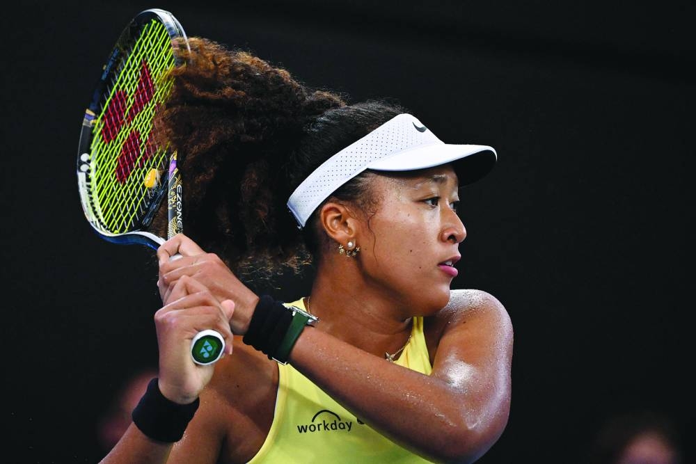 Japan’s Naomi Osaka hits a return against Germany’s Tamara Korpatsch during their singles match at the Brisbane International on Monday. (AFP)