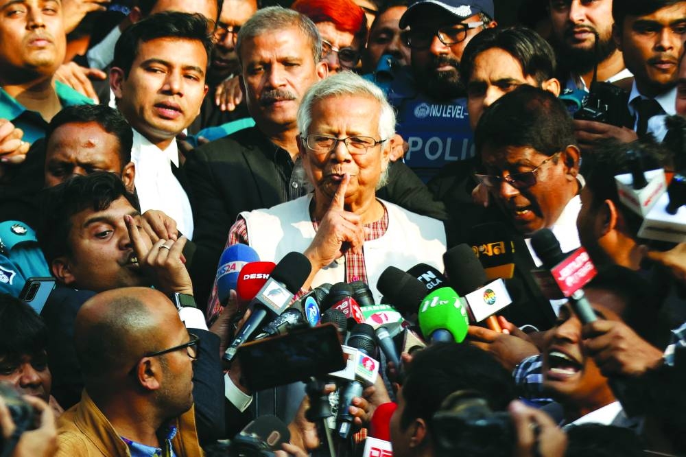 Nobel Peace laureate Mohamed Yunus gestures in front of the court in Dhaka after being sentenced to jail.