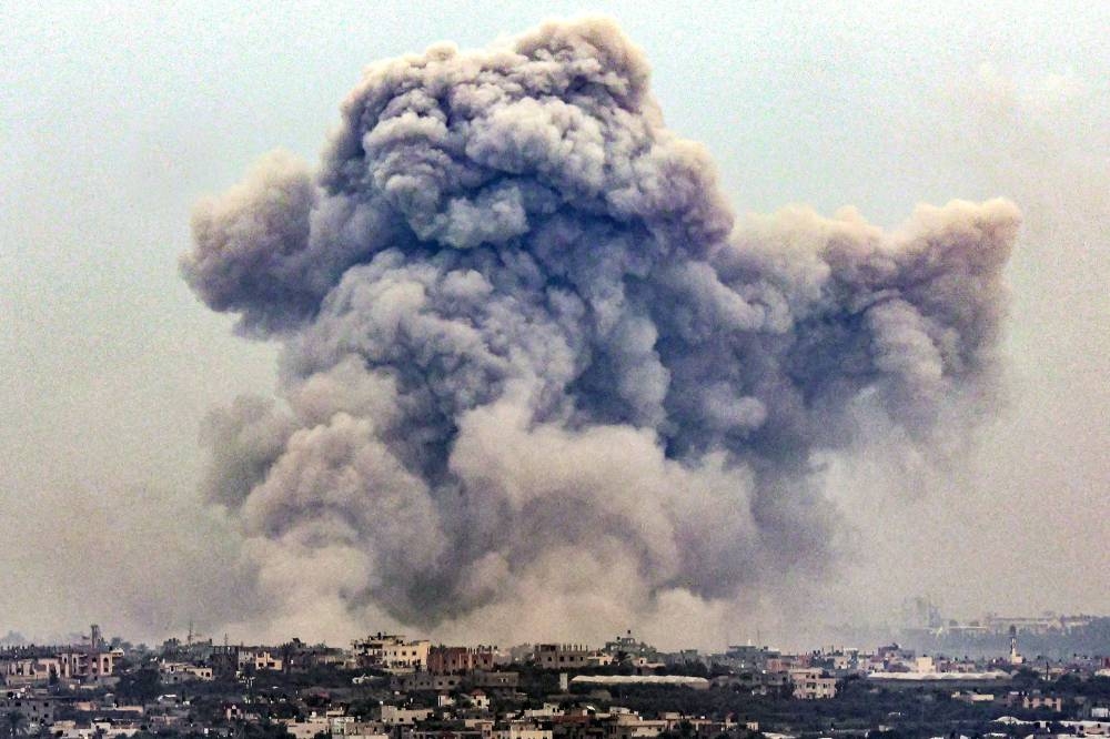 Smoke billows over Khan Yunis from Rafah in the southern Gaza strip during Israeli bombardment on Tuesday. AFP