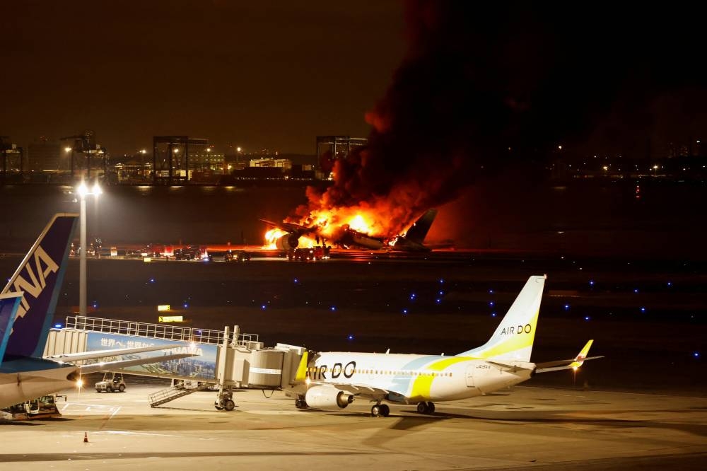 Japan Airlines' A350 airplane is on fire at Haneda international airport in Tokyo, Japan on Tuesday. REUTERS