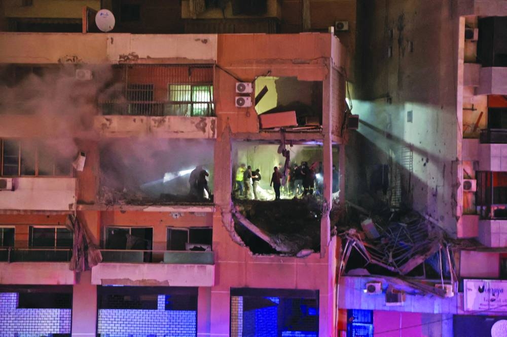 The damaged building following  the Israeli drone strike, at the Beirut suburb of Dahiyeh, Tuesday.