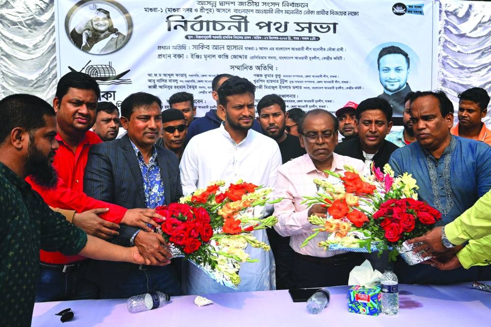 
Shakib Al Hasan, national cricket team captain and election candidate of the ruling Bangladesh Awami League, receives flowers during a campaign rally ahead of the 2024 general elections, in Magura. 