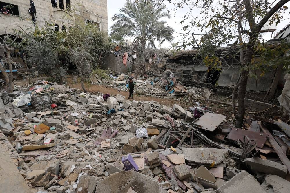 Palestinians inspect a house damaged in an Israeli strike in Rafah in the southern Gaza Strip, on Wednesday. REUTERS