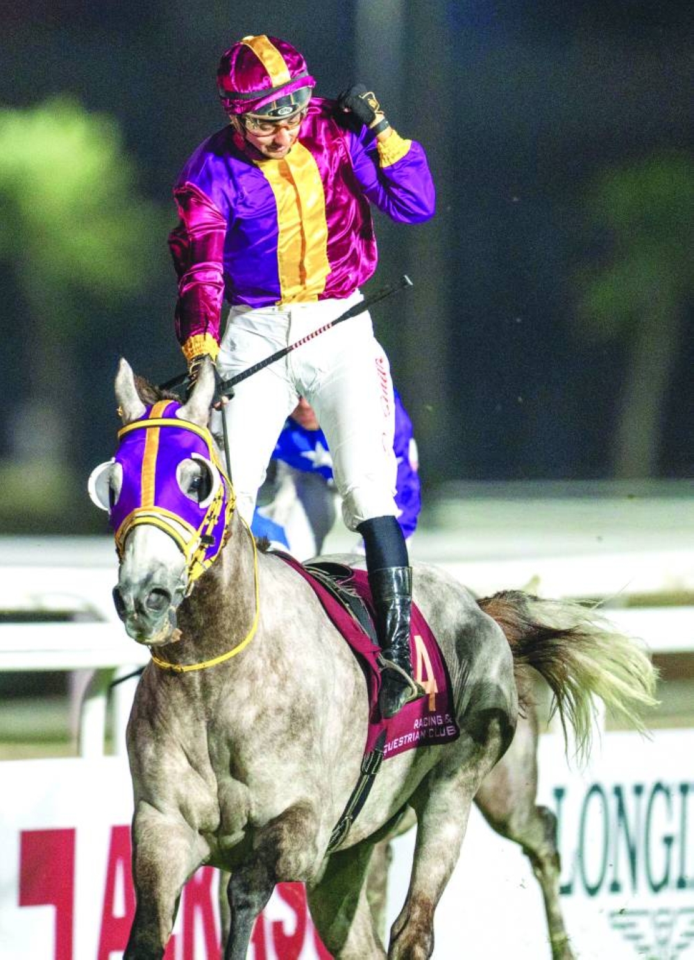 
Jockey Jefferson Smith celebrates after leading Eifrit to HH Sheikh Abdullah Bin Khalifa Al Thani Cup win. 