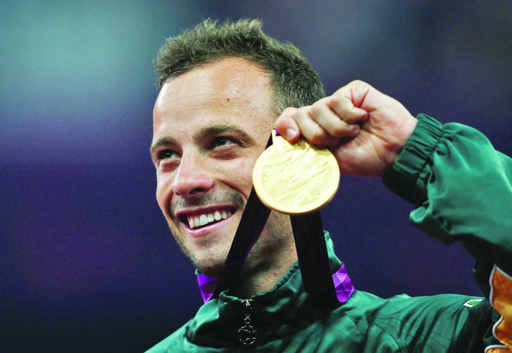 This 2012 picture shows Pistorius with his gold medal after winning the men’s 400m T44 classification at the Olympic Stadium during the London 2012 Paralympic Games.