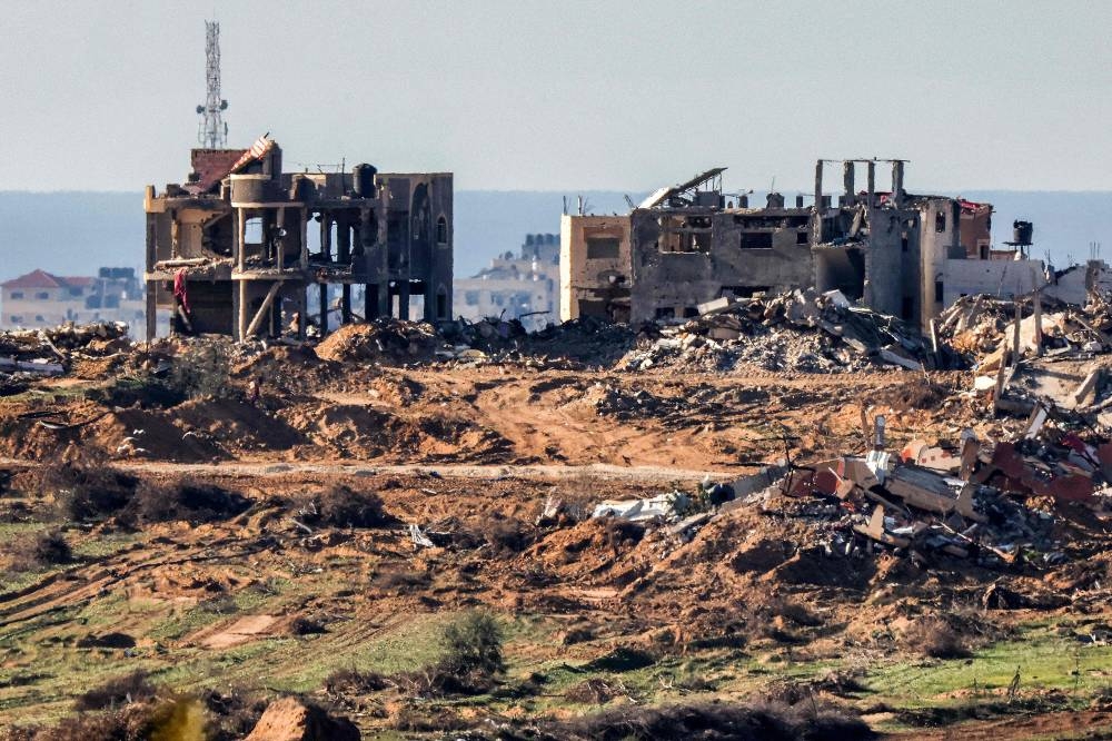 Buildings destroyed by Israeli bombardment in the Gaza Strip are pictured from a position along the border in southern Israel. AFP