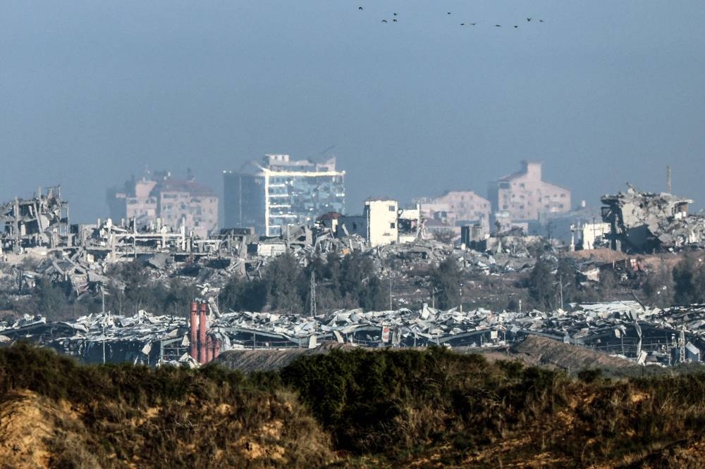 A view of buildings destroyed by Israeli bombardment in the central Gaza Strip, from a position across the border in southern Israel. AFP